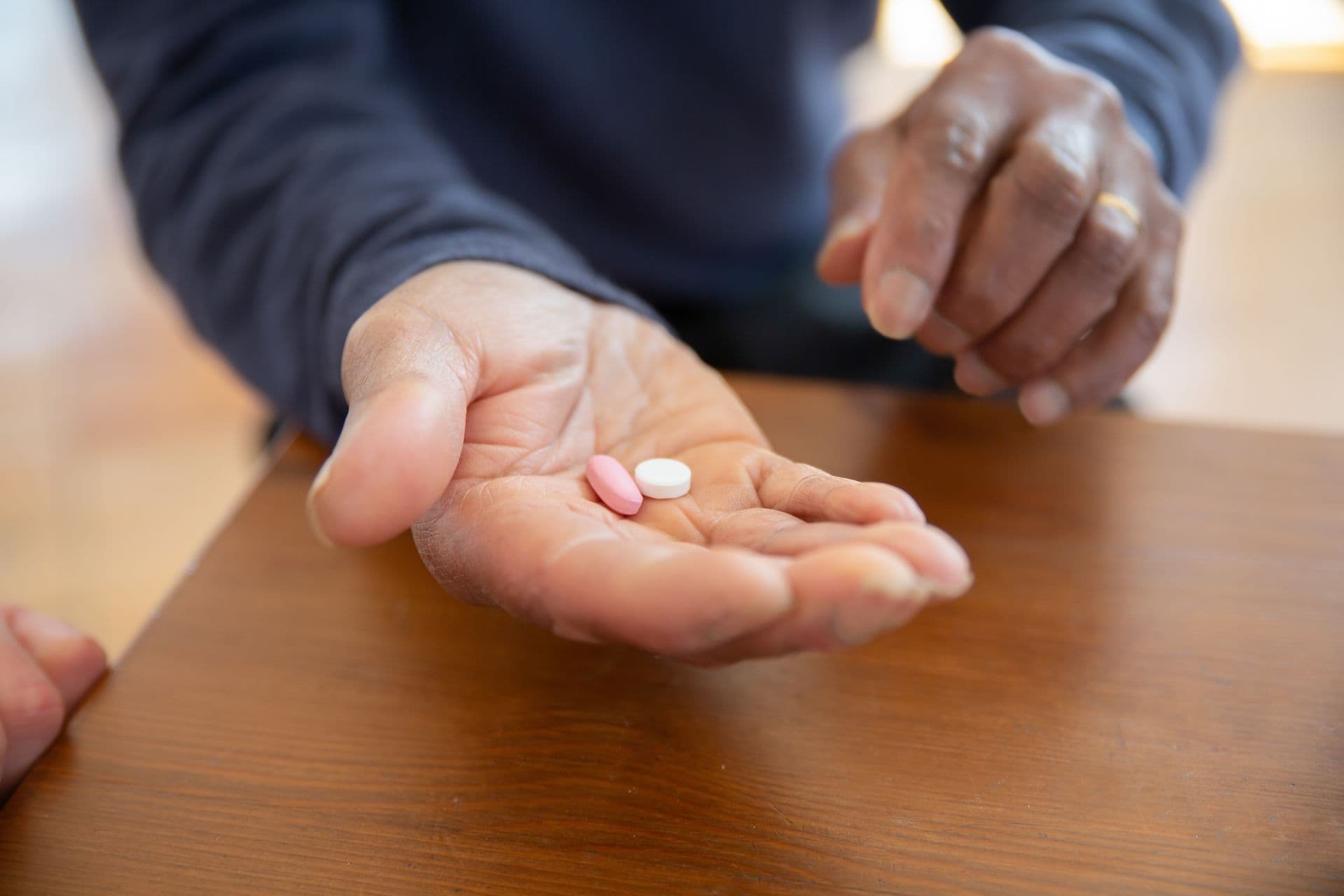 Caregiver assisting with medication