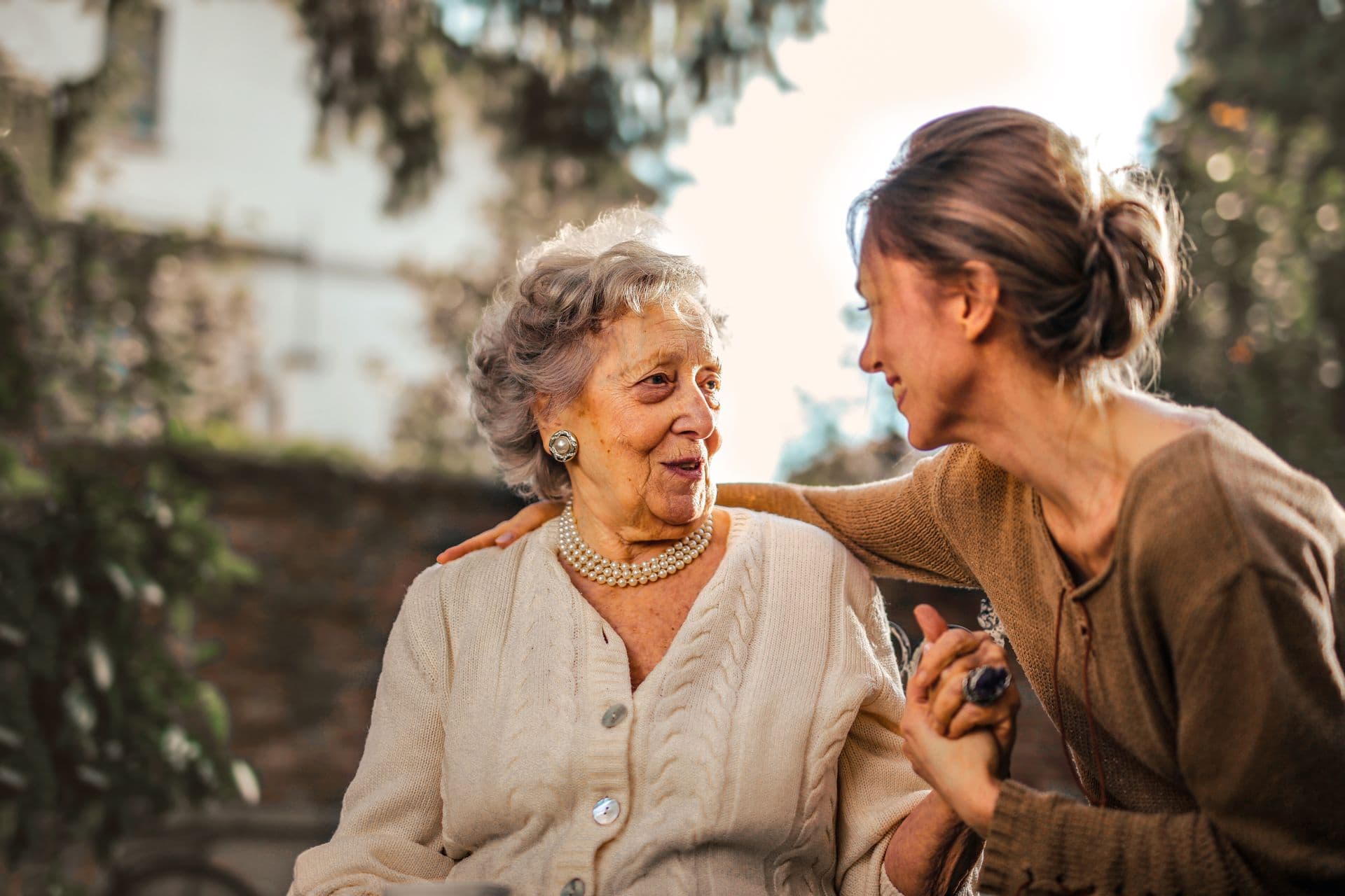 Elderly person enjoying time outdoors with companion